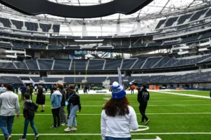 Visitors touring sofi stadium, the home of the los angeles rams and chargers.